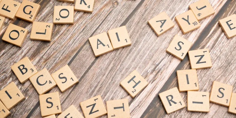 scrabble-tiles-on-a-wooden-table-with-the-word-rock